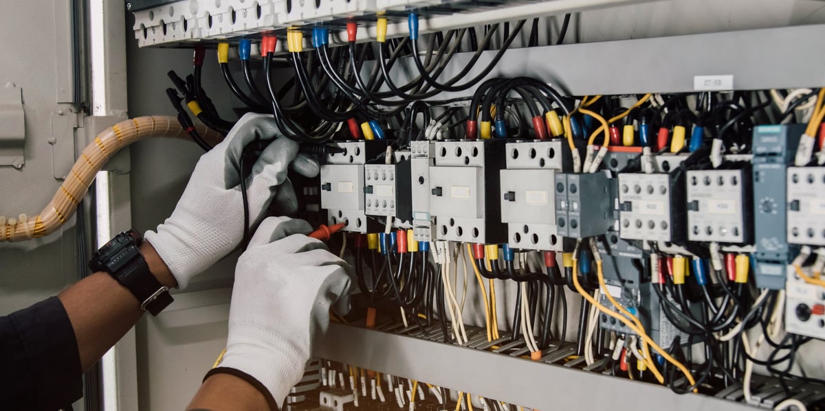 Electrician testing electrical installations and wiring